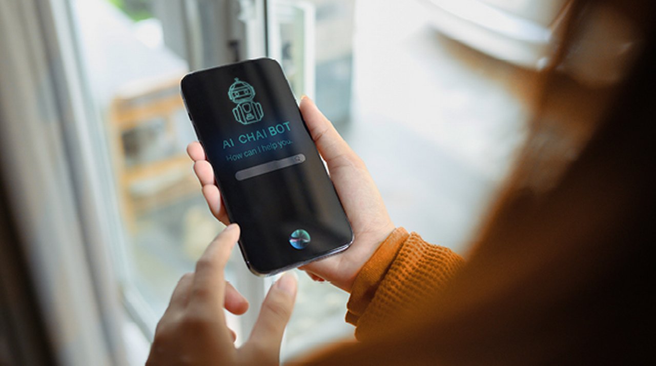 A person uses an AI chatbot on their smartphone