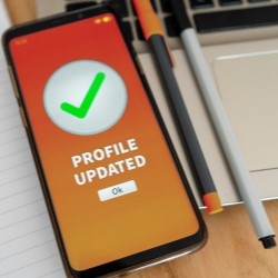 A smartphone on a desk showing a successfully completed update